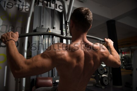 Young Man Doing Exercise For Biceps Stock photo © Jasminko