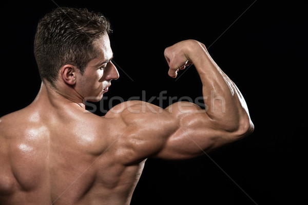 Flexionar jovem musculação músculos preto Foto stock © Jasminko