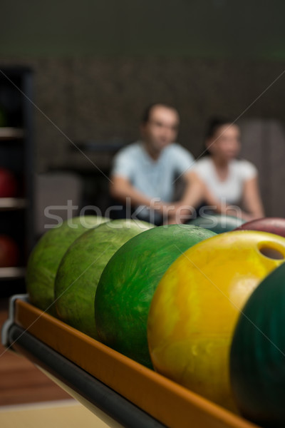 Beautiful Cheerful Couple Talking At The Bowling Alley Stock photo © Jasminko