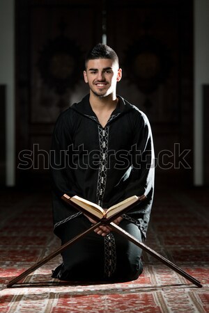 Stock photo: Young Muslim Man Reading The Koran