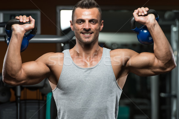 Muscular Man Exercise With Kettlebell Stock photo © Jasminko