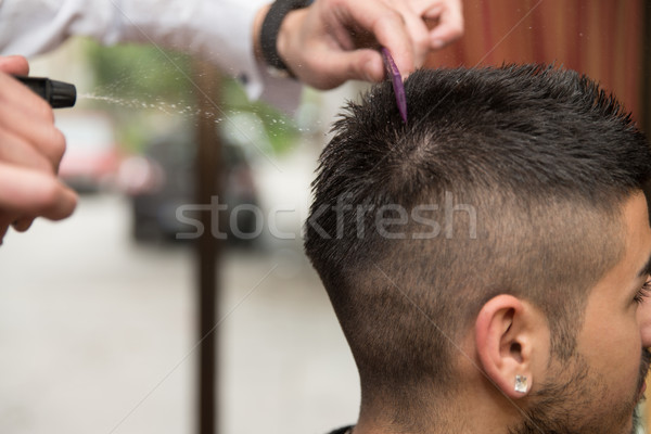 Male Hairstylist Water Sprayer On Hair On Hair Stock photo © Jasminko