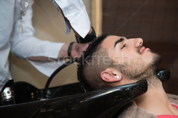 Stock photo: Hairstylist Hairdresser Washing Customer Hair