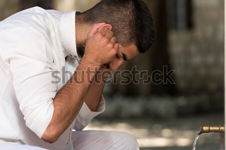 Islamic Religious Rite Ceremony Of Ablution Ears Washing Stock photo © Jasminko