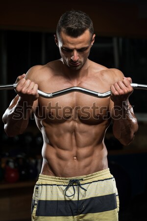Serious Men Standing And Flexing Muscles Stock photo © Jasminko