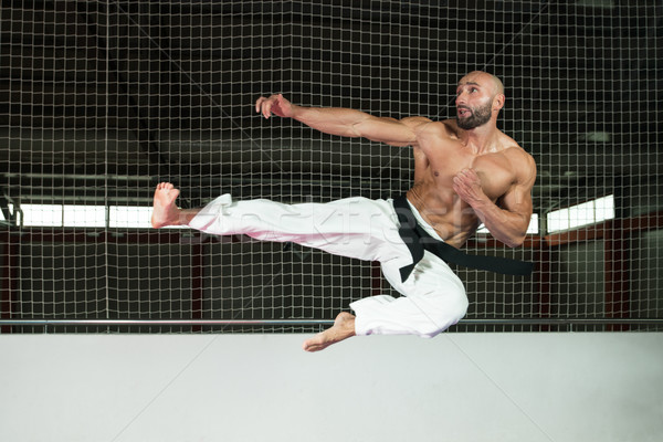 Mature Man Makes A Kick In Kimono Stock photo © Jasminko