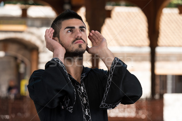 Muslim Man In Dishdasha Praying At Mosque Stock photo © Jasminko