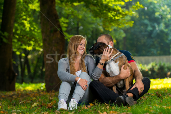Women Sitting Outdoors With Her Pet Dog German Boxer Stock photo © Jasminko