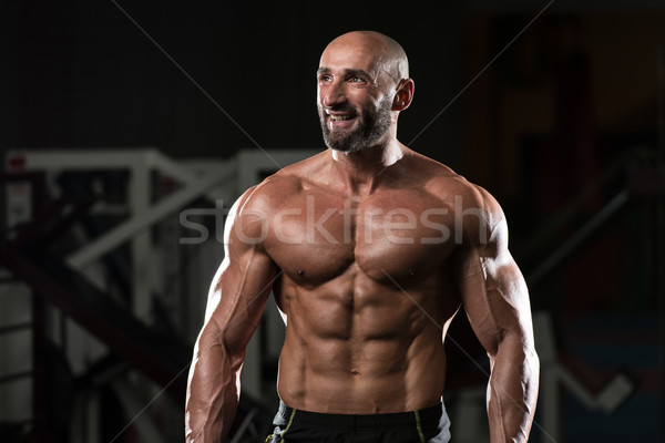 Mature Muscular Man Flexing Muscles Stock photo © Jasminko