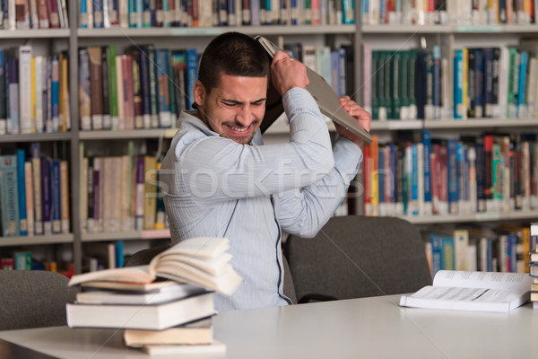 Csalódott diák dob laptop férfi sekély Stock fotó © Jasminko