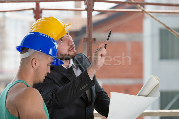 Engineer And Construction Worker Discussing A Project Stock photo © Jasminko