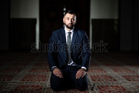 Muslim Man In Dishdasha Is Reading The Quran Stock photo © Jasminko