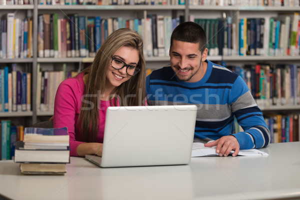 Stock photo: Couple Of Students With Laptop In Library