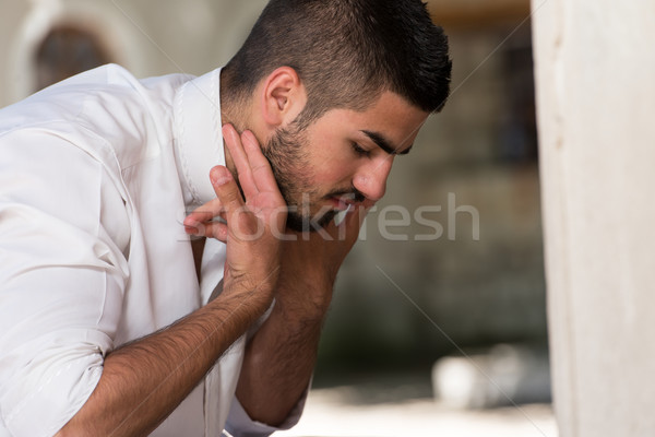 Islamic Religious Rite Ceremony Of Ablution Ears Washing Stock photo © Jasminko