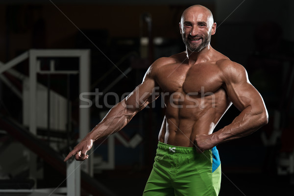 Mature Muscular Man Flexing Muscles Stock photo © Jasminko