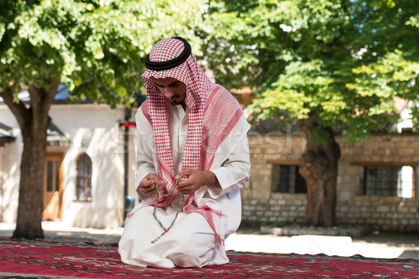 Young Muslim Man Praying Stock photo © Jasminko
