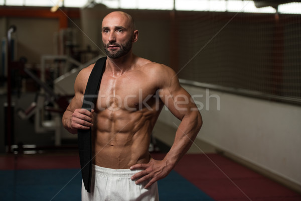 Sexy muskuläre Mann schwarz Gürtel Schulter Stock foto © Jasminko