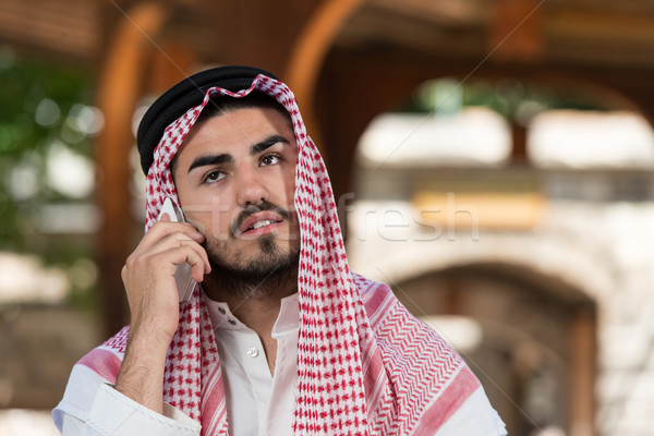 Handsome Middle Eastern Man Talking On Mobile Phone Stock photo © Jasminko