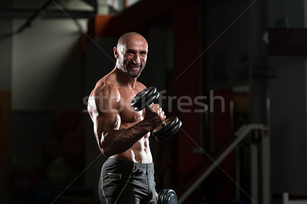 Mature Bodybuilder Working Out Biceps Stock photo © Jasminko
