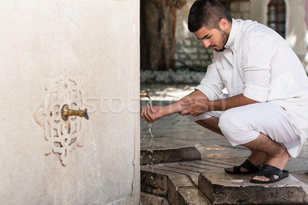 Islamic Religious Rite Ceremony Of Ablution Hand Washing Stock photo © Jasminko