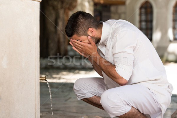 Islamic Religious Rite Ceremony Of Ablution Face Washing Stock photo © Jasminko