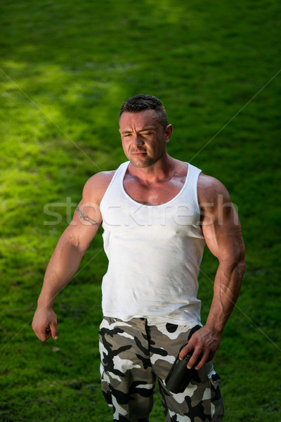 Bodybuilder Resting And Drinking Protein Shake Stock photo © Jasminko