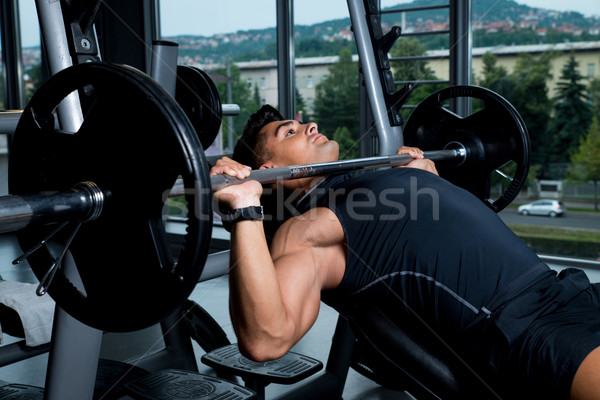 Banco prensa ejercicio deporte cuerpo hombres Foto stock © Jasminko