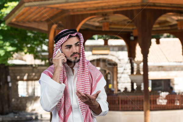 Handsome Middle Eastern Man Talking On Mobile Phone Stock photo © Jasminko