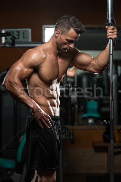 Stock photo: Young Muscular Men Resting After Exercises