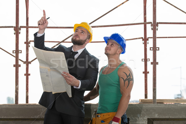 Engineer And Construction Worker Discussing A Project Stock photo © Jasminko