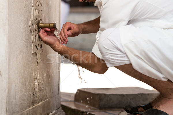 Islamic Religious Rite Ceremony Of Ablution Hand Washing Stock photo © Jasminko