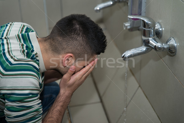 Islamic Religious Rite Ceremony Of Ablution Face Washing Stock photo © Jasminko