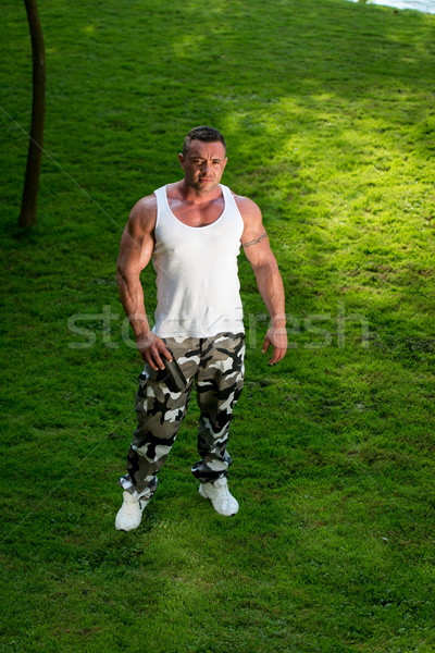 Man Holding Protein Bottle Stock photo © Jasminko