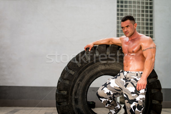 Muscular Man Resting After Tire Workout Stock photo © Jasminko