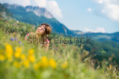 beautiful women laughing and lying on the grass Stock photo © Jasminko