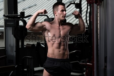 male bodybuilder doing heavy weight exercise for back Stock photo © Jasminko