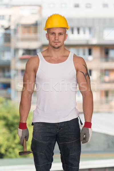 Bau Mann arbeiten Hammer gut aussehend Business Stock foto © Jasminko
