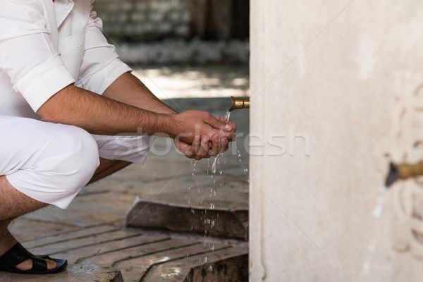 Islamic Religious Rite Ceremony Of Ablution Hand Washing Stock photo © Jasminko