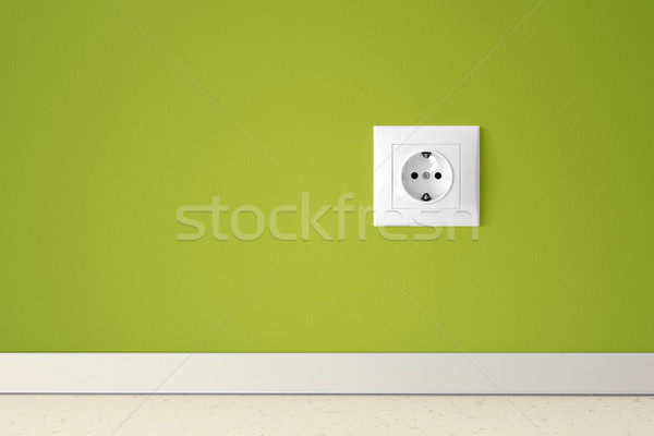 Green wall with european electric outlet Stock photo © jaycriss