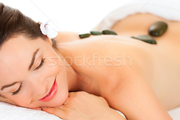 Beautiful woman getting hot stone massage Stock photo © jaykayl