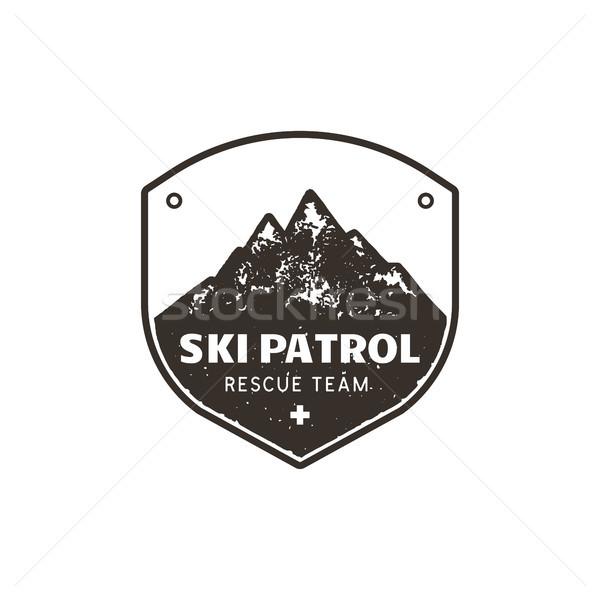 Stock photo: Vintage hand drawn mountain ski patrol emblem. Rescue team patch. Mountains stamp. Monochrome, grung