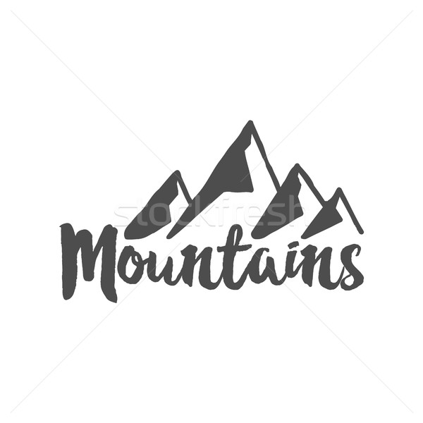Stock photo: Hand drawn mountain badge. Wilderness old style typography label. Letterpress Print Rubber Stamp Eff