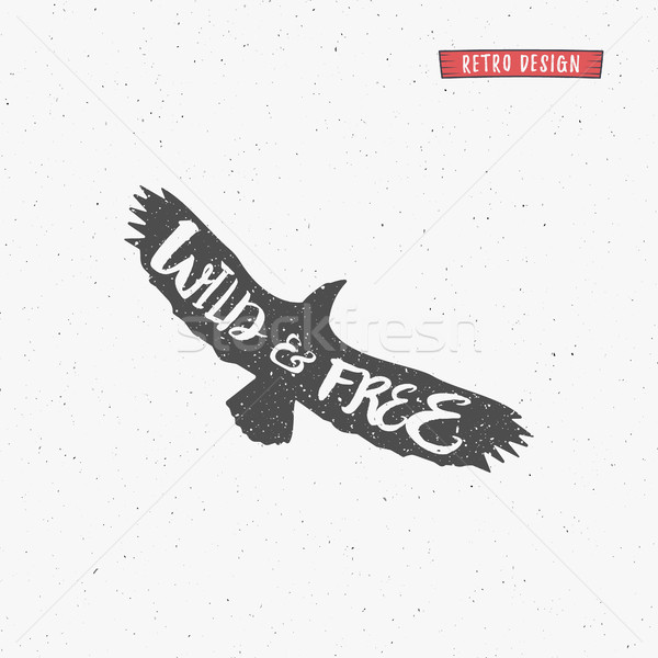 Vintage eagle with handdrawn lettering slogan. Retro silhouette monochrome animal design with inspir Stock photo © JeksonGraphics