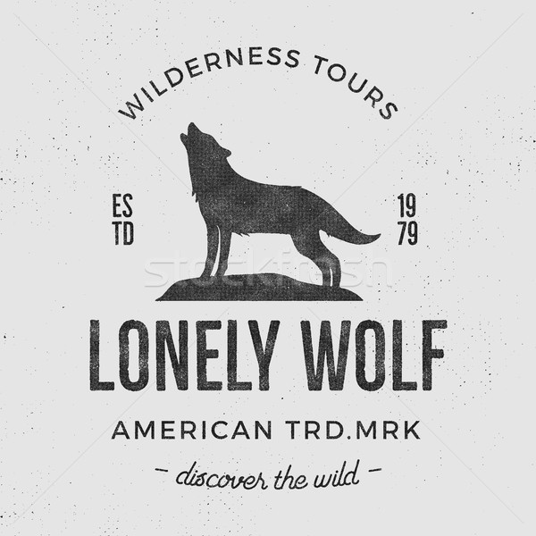 Old wilderness label with wolf and typography elements. Vintage style wolf logo. Prints of howling w Stock photo © JeksonGraphics