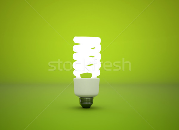 Compact fluorescent light bulb green background Stock photo © jezper