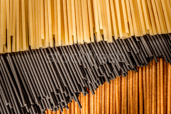 Three different colours of raw spaghetti Stock photo © JFJacobsz
