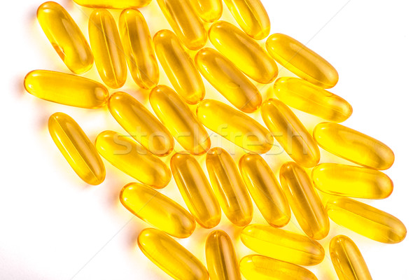 Yellow Gel Pills on White Stock photo © JFJacobsz