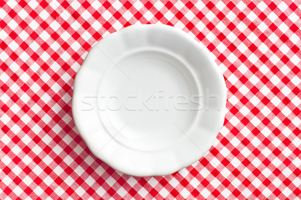 white old plate on checkered napkin Stock photo © jirkaejc