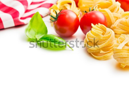 Italiana pasta tagliatelle pomodori basilico foglie Foto d'archivio © jirkaejc