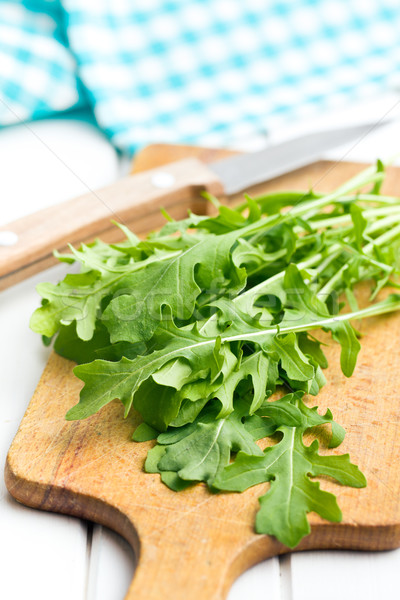 fresh arugula leaves on kitchen table Stock photo © jirkaejc